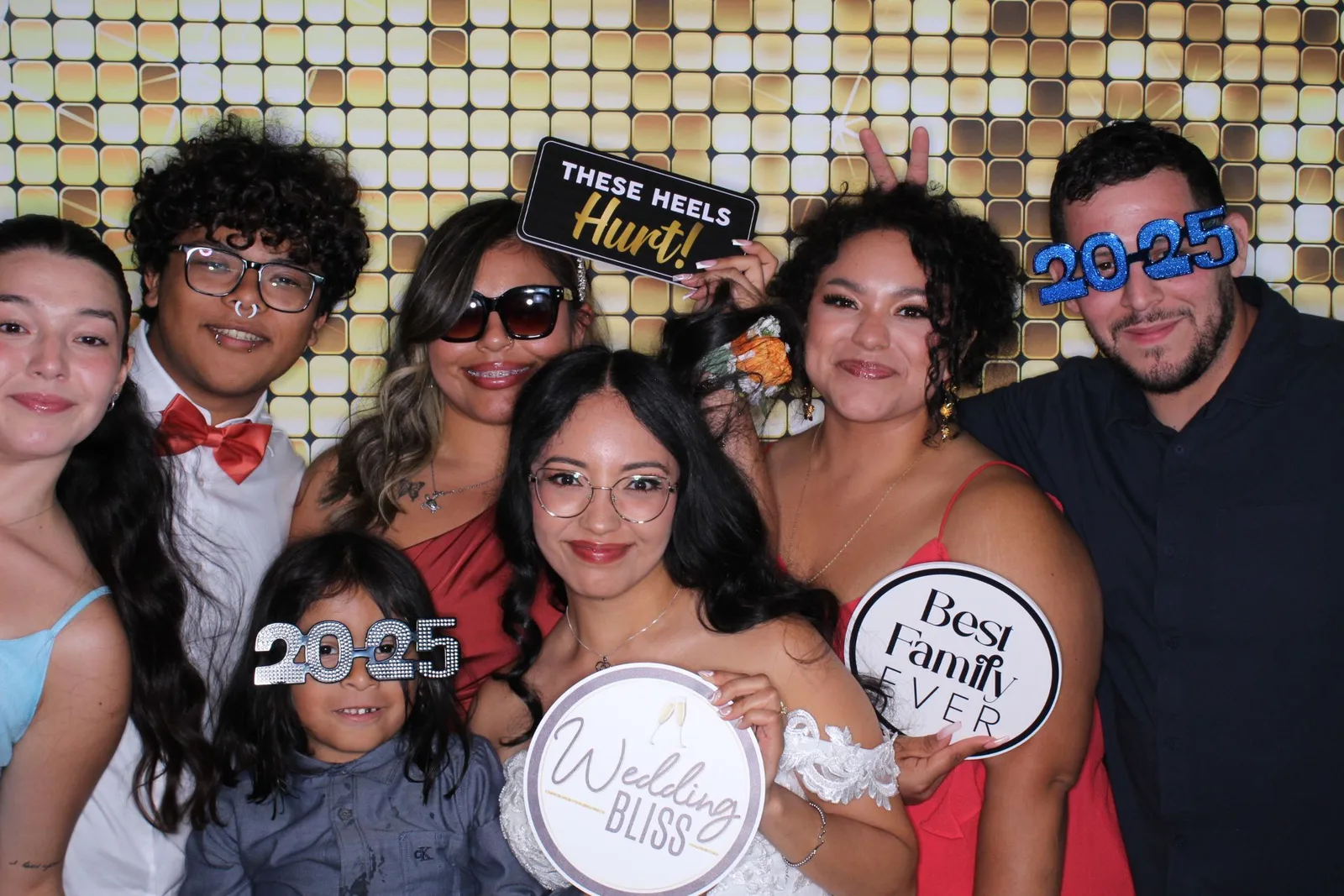 Guests posing with props at an EPiK Productions photo booth rental
